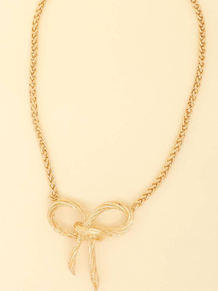 COLLANA A CATENA CON CIONDOLO A FORMA DI FIOCCO INTAGLIATO N16313 per la vendita all'ingrosso da parte di anbfashion