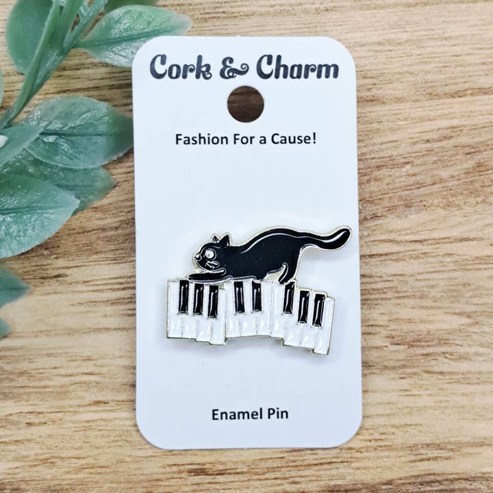 Black Cat Music Piano Keyboard Enamel Pin for wholesale by Cork and Charm