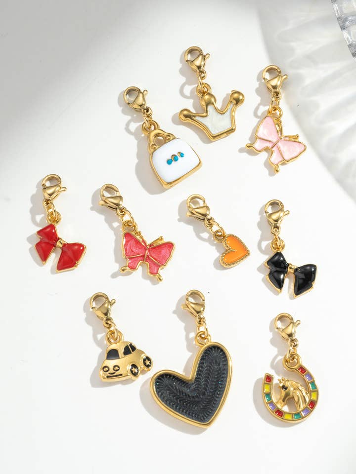 Set of 10 assorted stainless steel charm pendants for wholesale by COSMOS