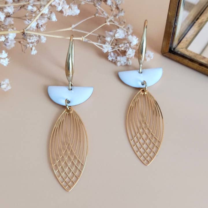 L'Audacieuse white shuttle pendant earrings for wholesale by Sophie Bijoux