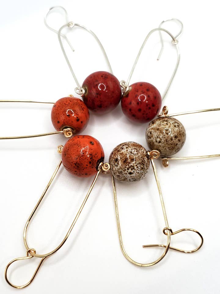 Earrings, Swinging Arches w/ Ceramic Orbs, Warm Colors for wholesale by Jezabel Adornment