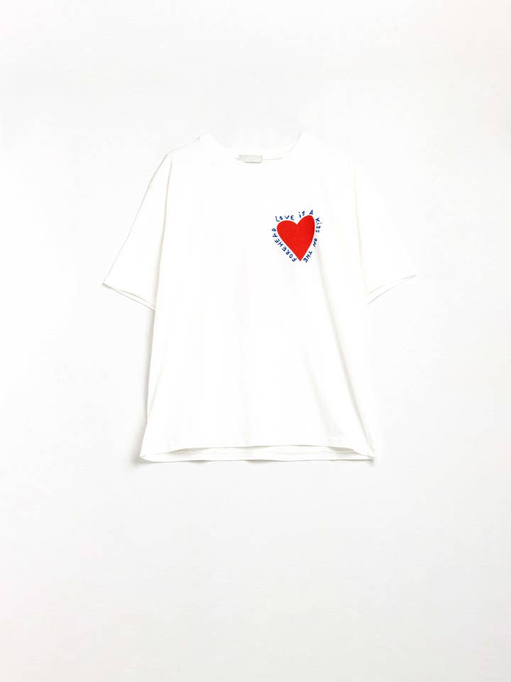 Relaxed white T-shirt featuring a heart design on both the front and back for wholesale on Faire