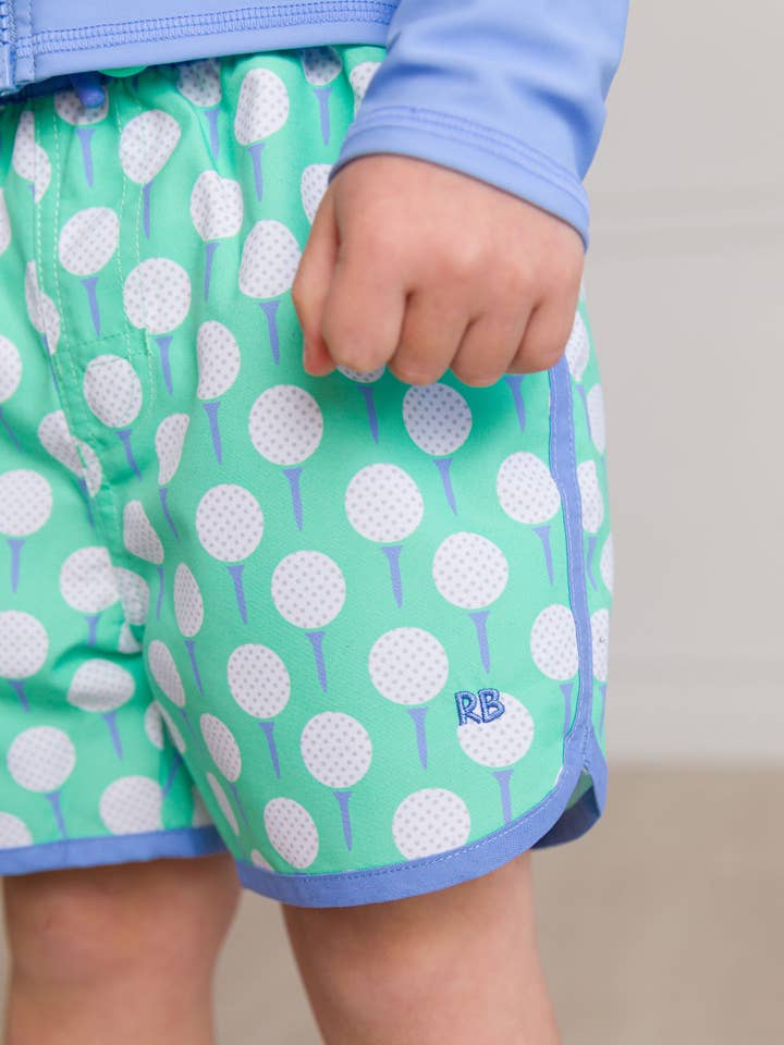 Green Boys Tee Time Dolphin Hem Swim Trunks for wholesale on Faire