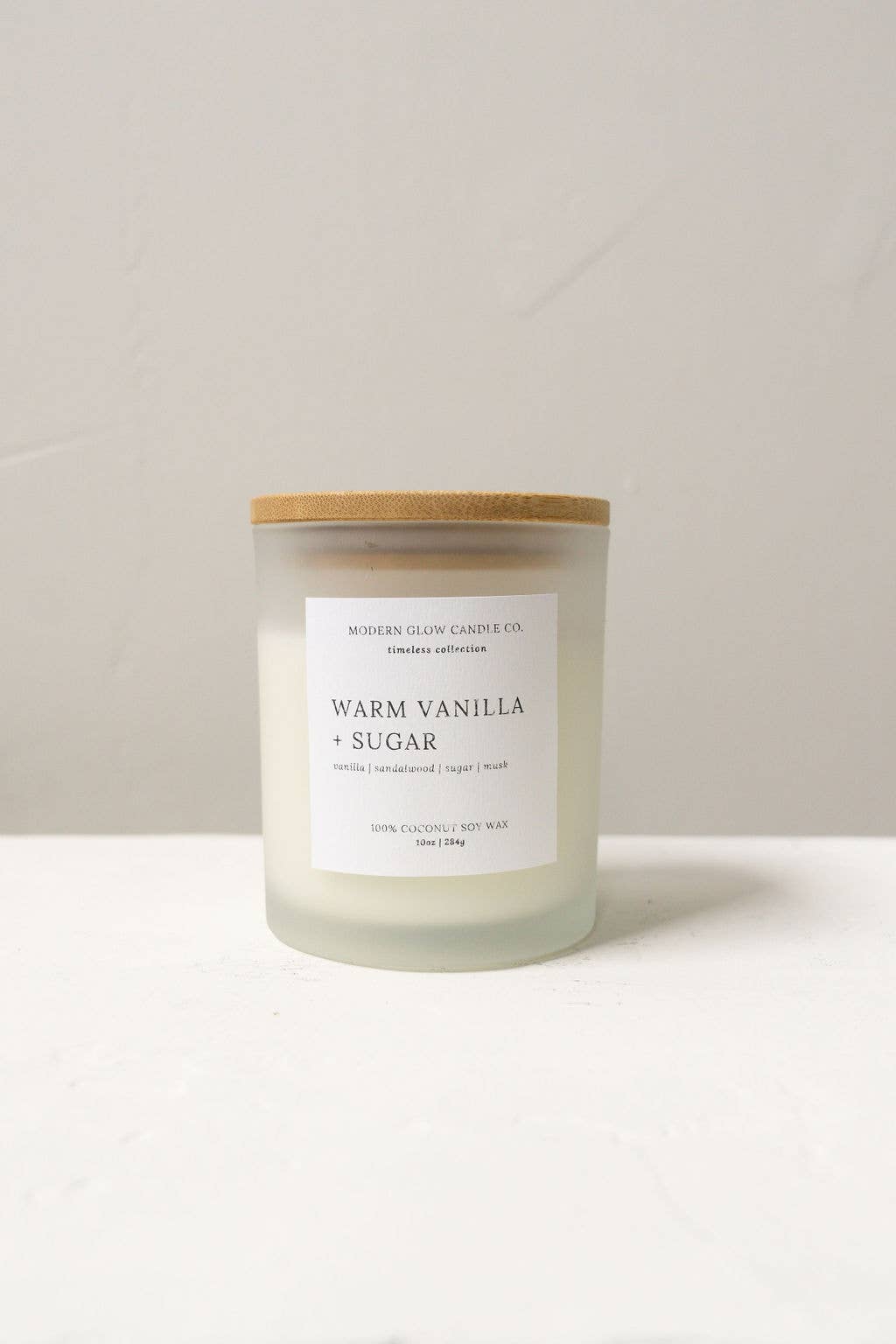 Modern Glow Candle Co. - Wholesale Jar/Filled Candle - Warm Vanilla + Sugar - 10oz Frosted White Soy Candle1