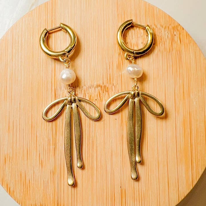 Pearl Bow Huggie Earring for wholesale by Santore Jewelry Company
