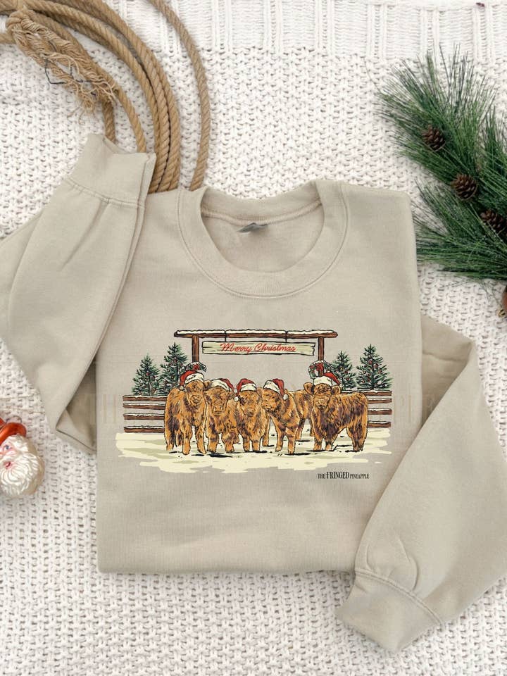 Merry Christmas Highlands Sweatshirt or Tee for wholesale by The Fringed Pineapple