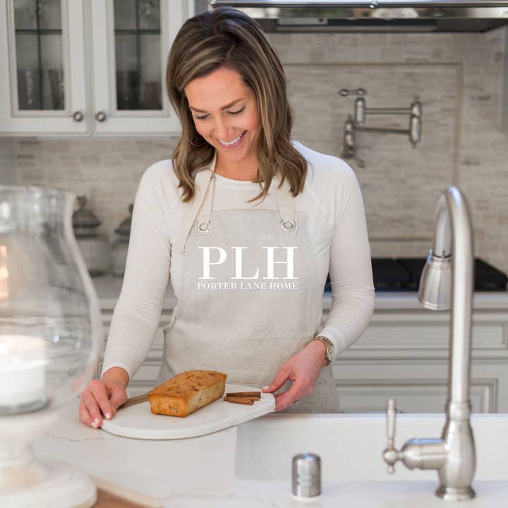 Natural Delantal de diseño personalizado. de venta al por mayor en Faire2