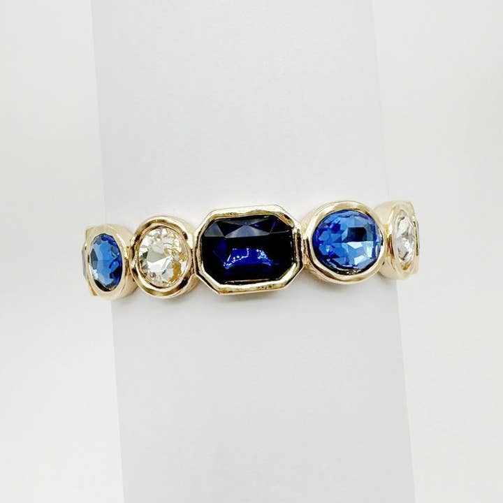 Gouden stretcharmband met blauwe en heldere kristallen voor wholesale door What's Hot