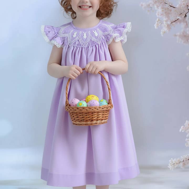Purple Geometric Smocked Angel Wing Sleeve Bishop Dress featuring 3 Little Bunnies Embroidered for wholesale by Hello Bebes!