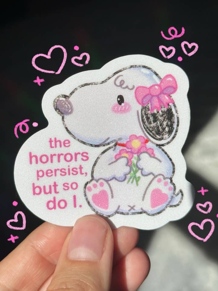 Coquette Dog āThe horrors persist, but so do Iā Sticker for wholesale by Uni & Umi