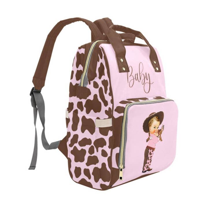 TJtoddles.com - Wholesale Diaper Bag - Baby - Designer Diaper Bags - Cute Cowgirl With Brown Cow Print On Soft Pink Waterproof Diaper Bag