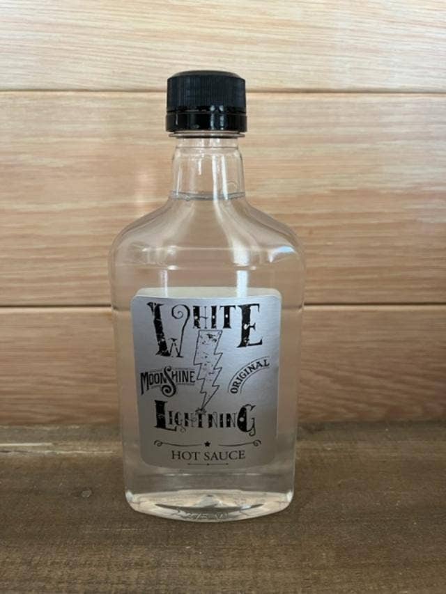 White Lightning Moonshine Hot Sauce - Originele grote fles voor wholesale door Fairhope Favorites, Inc.