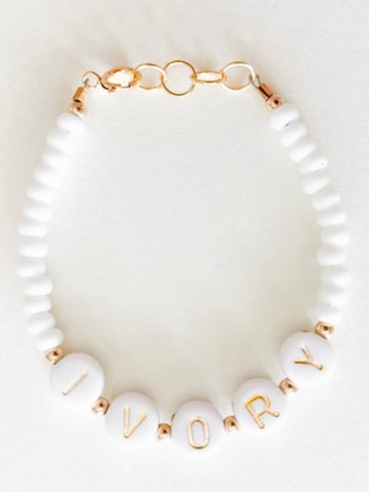 Baby/toddler Gold and white name bracelet for wholesale by LITTLELUNDSCO