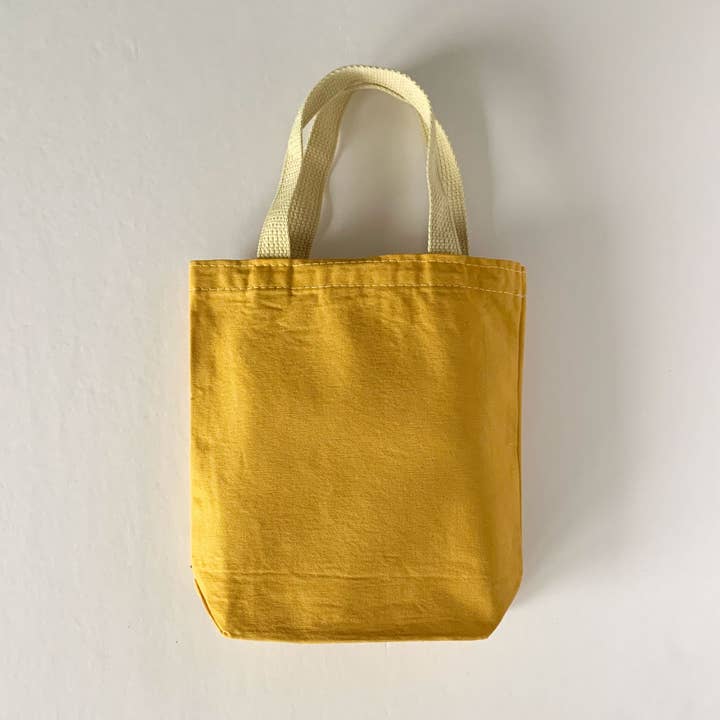 Ocher Hand Dyed Tote Bag: Dyed By Hand in Ocher Dye and other Purchase Wholesale fabric dye. Free Returns & Net 60 Terms on Faire trending on Faire.