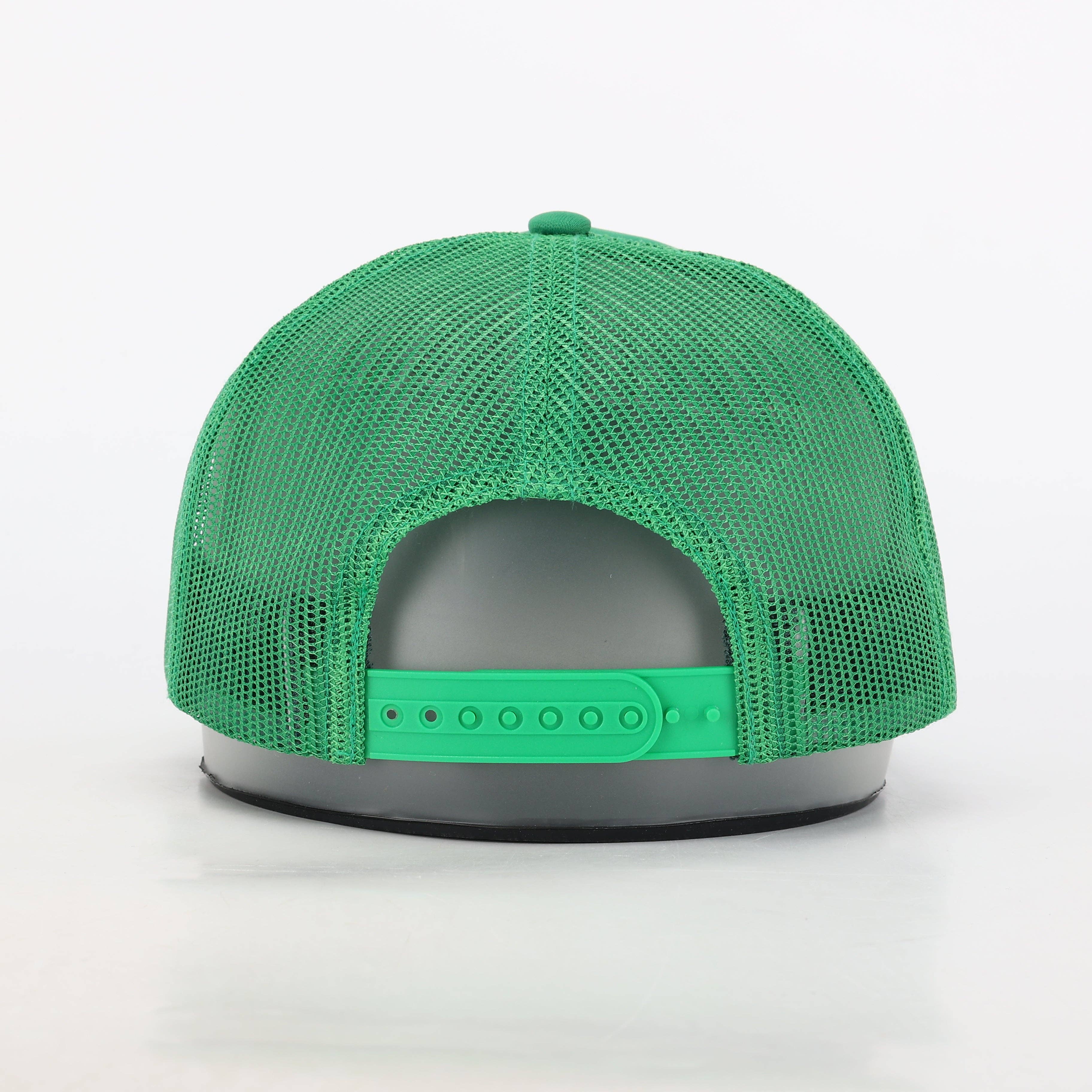 Meet Me Under The Mistletoe Trucker Hat in Green for wholesale on Faire6