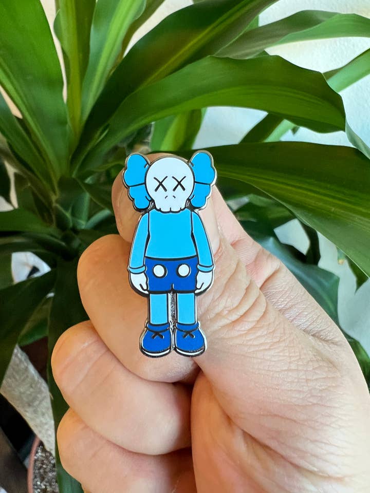 HypeBeast KAWS Blue Sky Hard Enamel Pin for wholesale by Hype Pins