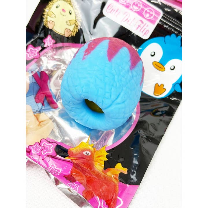 MIX COLOR Treasure Box Reversible Dinosaur Egg Squishies for wholesale on Faire