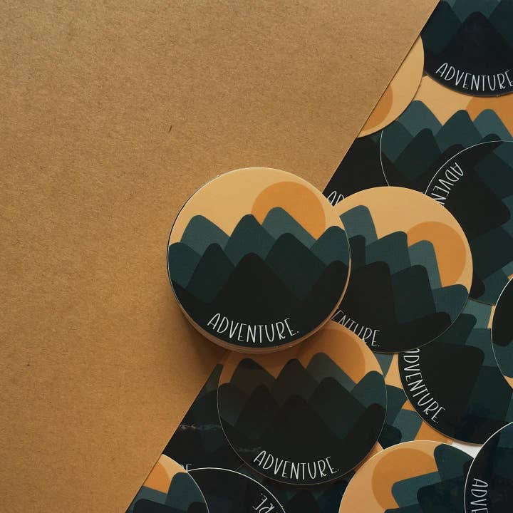 “Adventure” Circle Sticker for wholesale by Happy Cam Designs