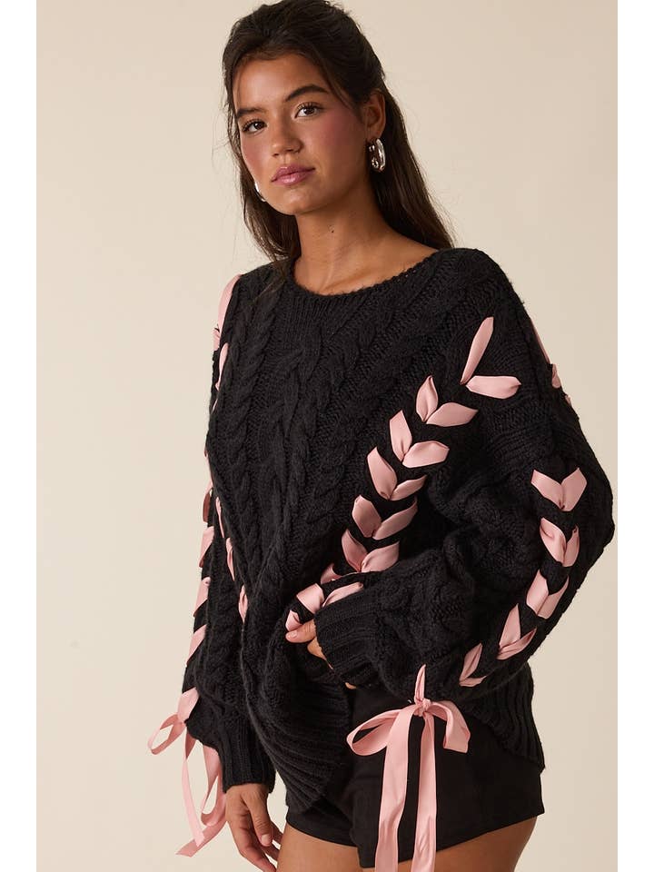 NOIR PULL EN MAILLE CÂBLÉE À MANCHES LONGUES AVEC RUBAN ROSE PÂLE en vente sur Faire2