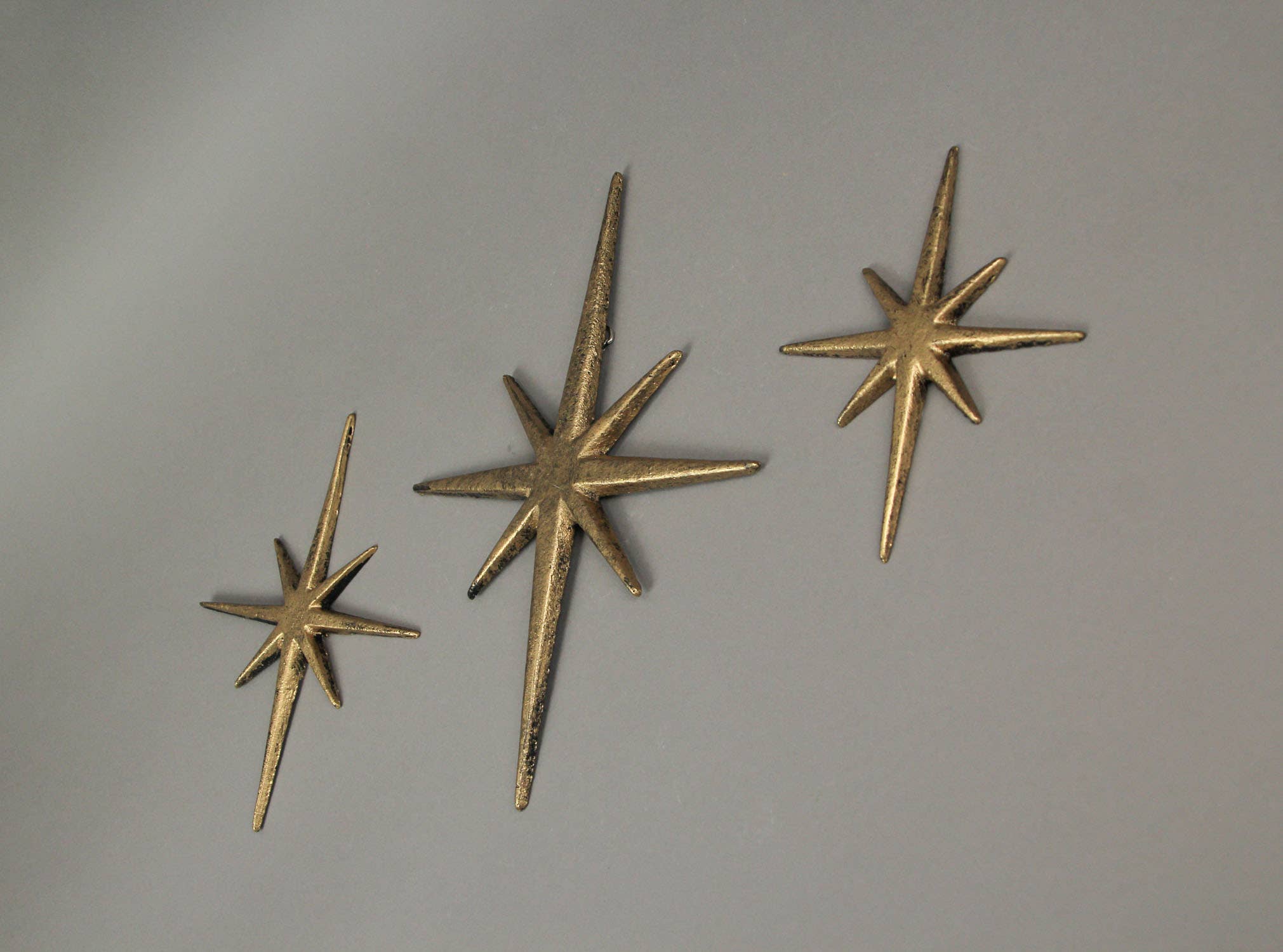 Zeckos - Wholesale Wall Accent - Large Set of 3 Metallic Gold Cast Iron Starburst Wall Decor1
