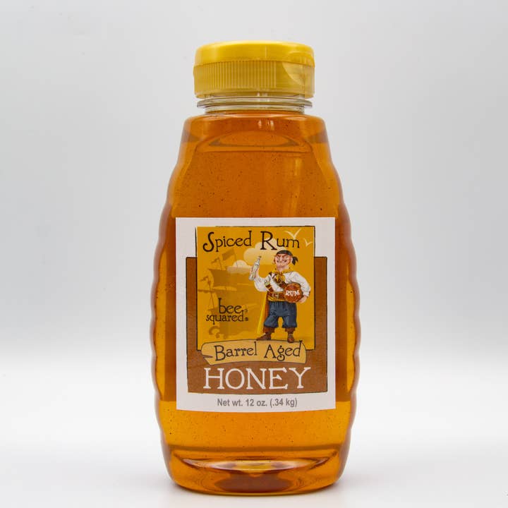 12 oz. Squeeze- Spiced Rum Barrel Aged Honey for wholesale by Bee Squared Apiaries