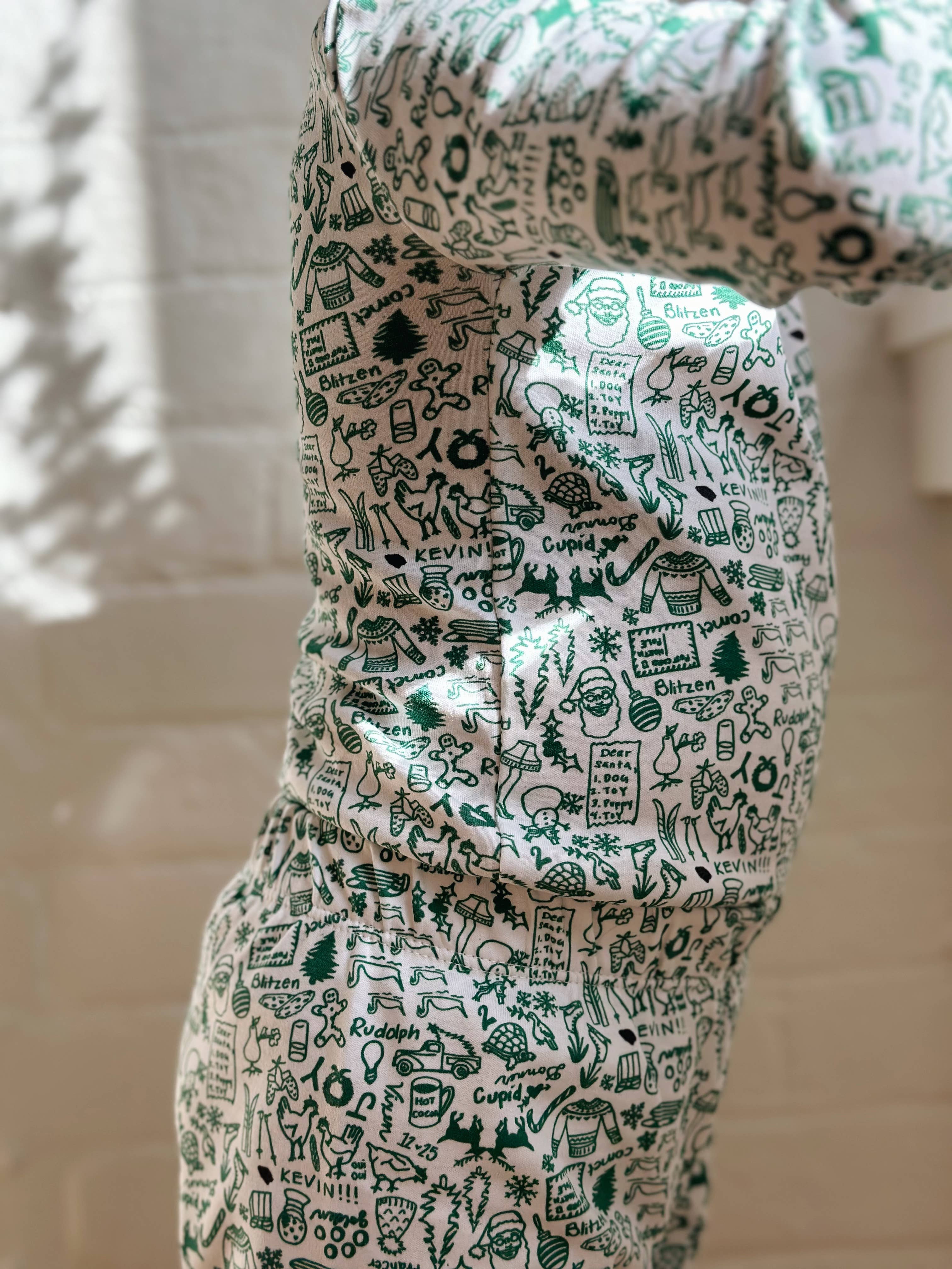 North Pole Christmas Two Piece Kids Henley Pajamas for wholesale on Faire2