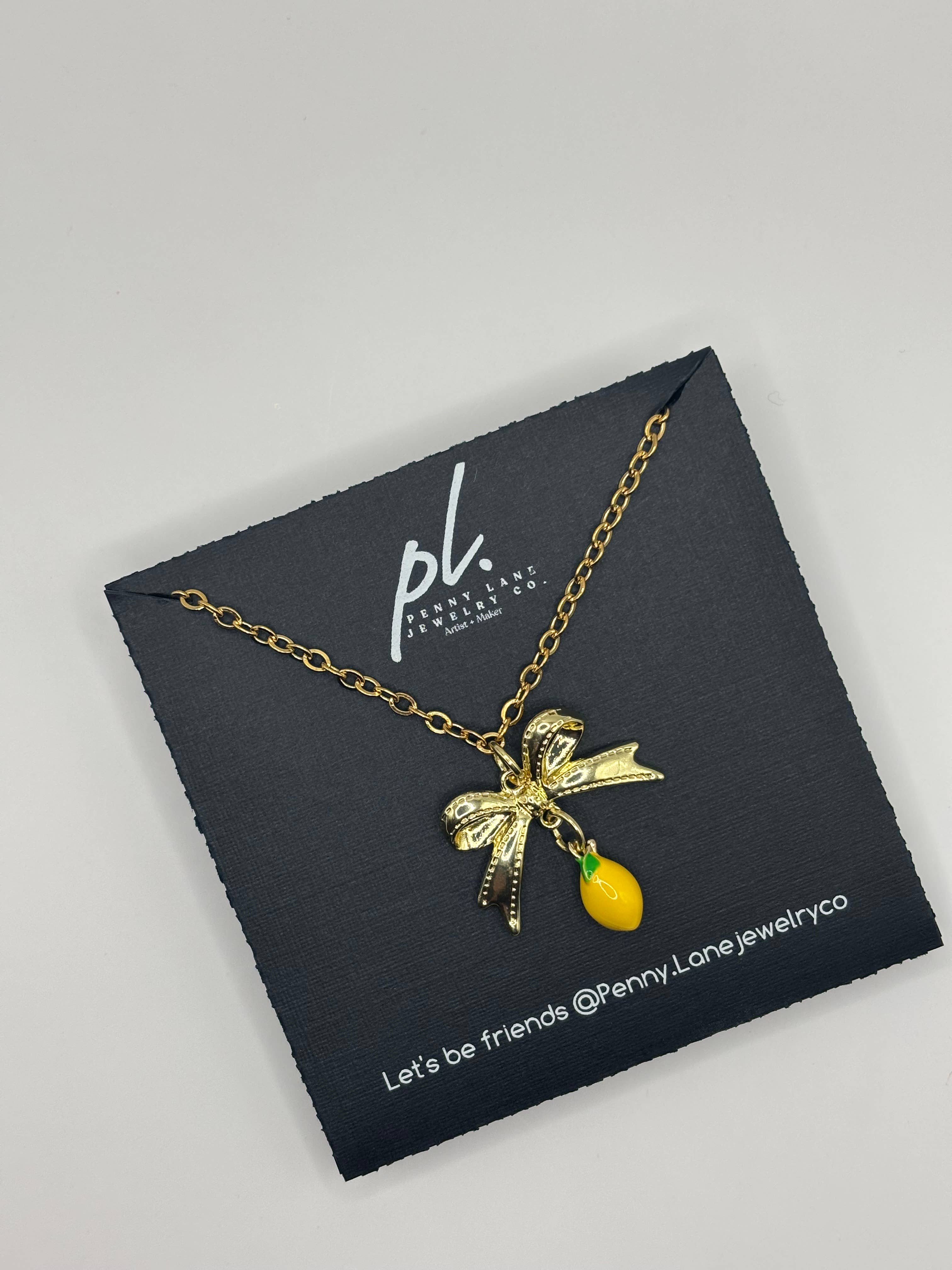 Penny Lane Jewelry Co - Wholesale Pendant/Charm Necklace - Daphne Gold Lemon Bow charm necklace 3