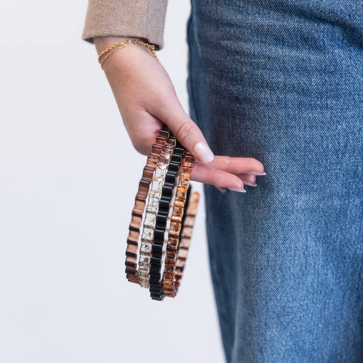 Dunne golvende hoofdbandset - zwart + helder voor wholesale door Headbands of Hope | One Purchased One Donated