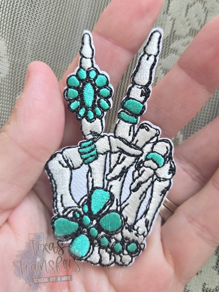 Turkis Ringe Fred Skelet Strygemærke for engroshandel hos Texas Transfers