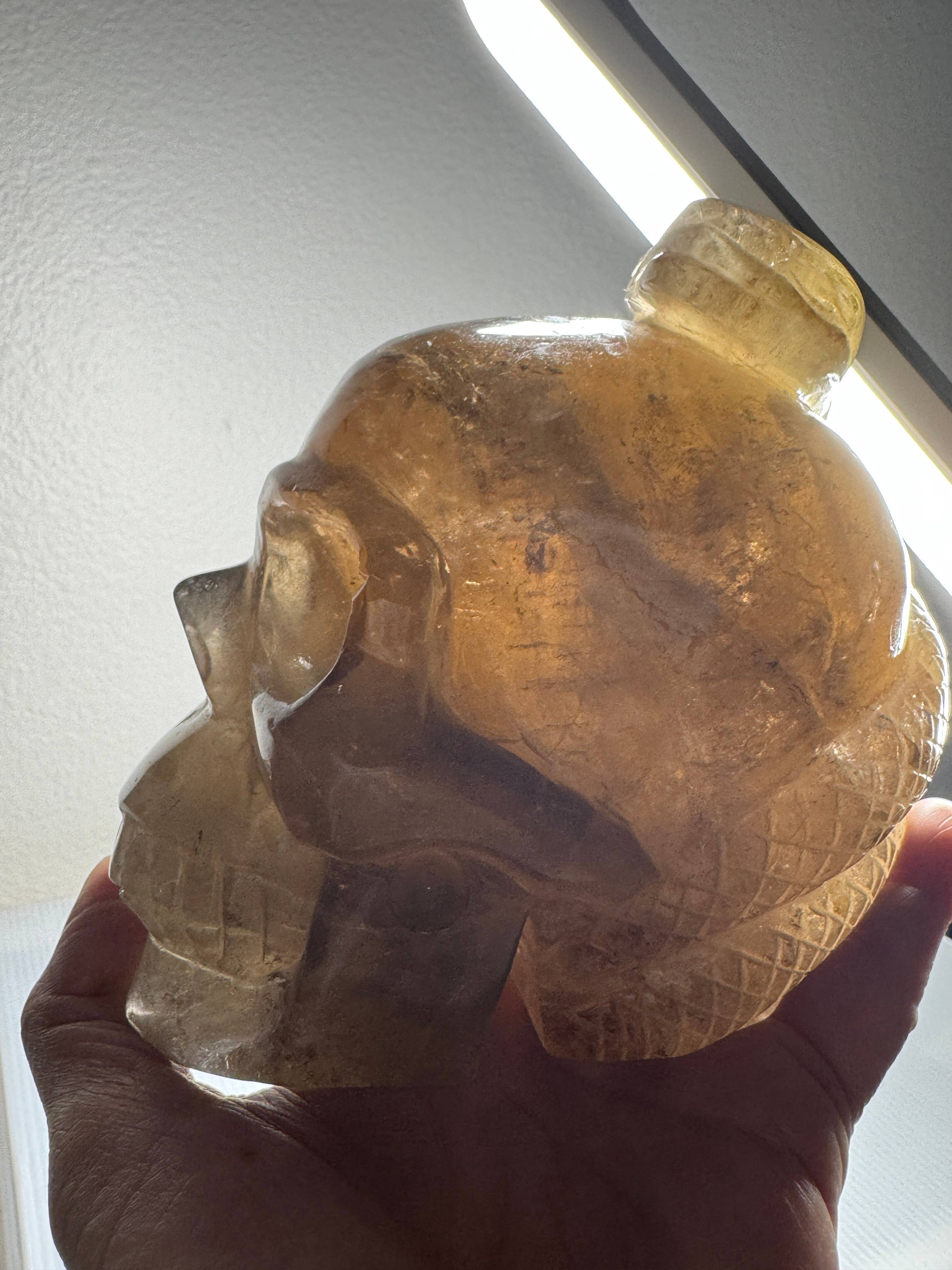 The 7 Directions - Wholesale Spiritual Stone/Crystal - 3.9 lb Unique Smoky skull w/ snake carving H3611
