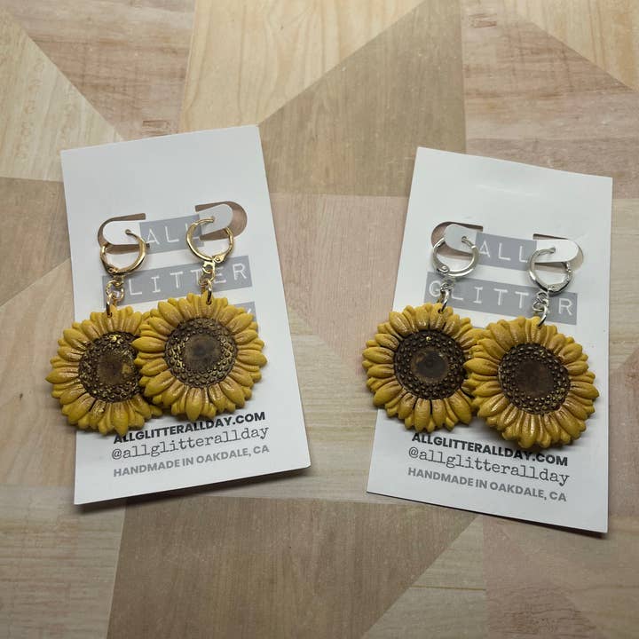 Modern sunflower huggy hoop Dangle #1 for wholesale by All GlitterAll Day