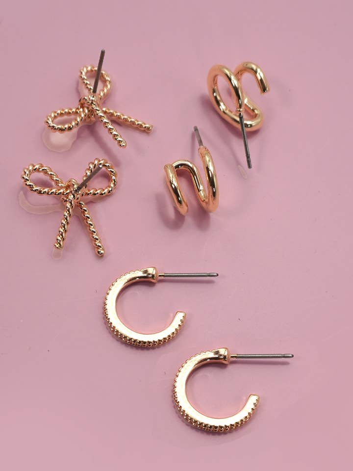 TRIO HUGGIE BOW HOOP TITANIUM POST EARRINGS | 80E06205 for wholesale by JOSSLYN by wall to wall