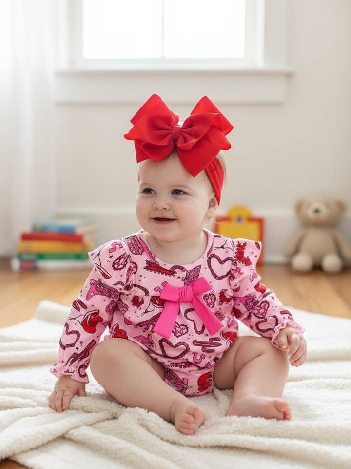 Heart  printed baby romper with pink front bow. RPG60053 JEAN for wholesale by Kids Charm Online