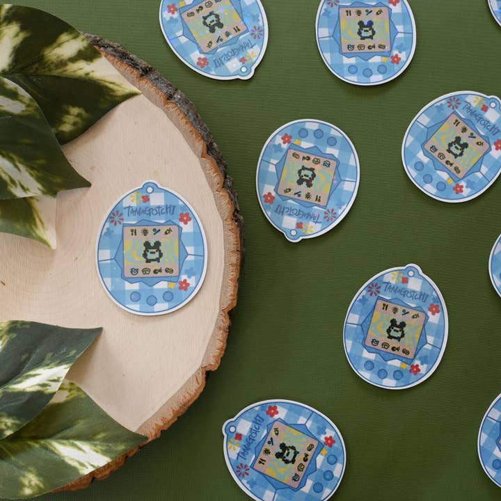 Plaid Tamagotchi Sticker for wholesale by Giselle Luna