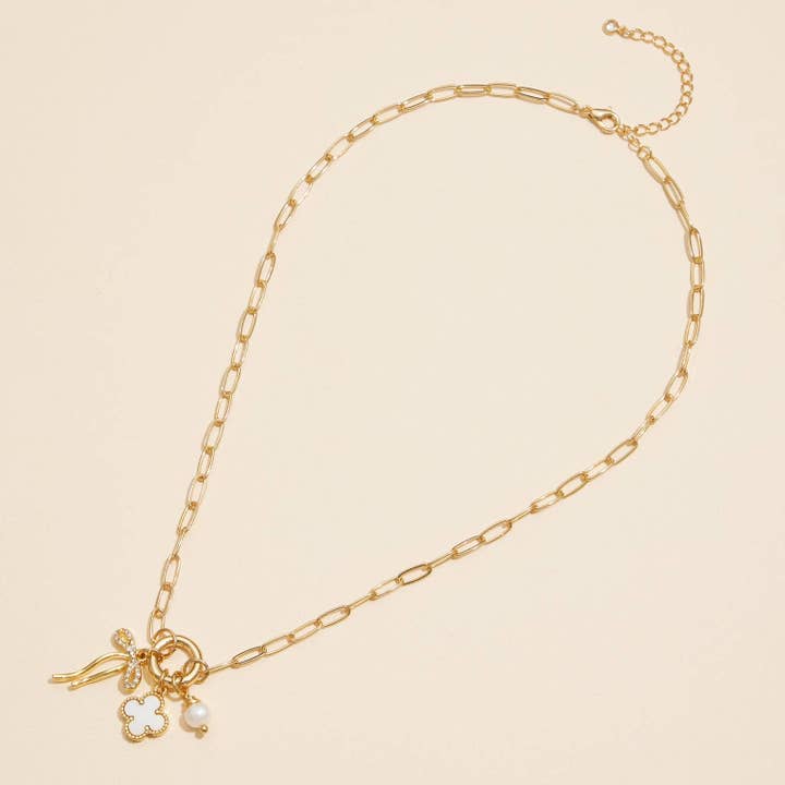 Gold Dipped Bow Charm Necklace with Clover and Pearl for wholesale on Faire