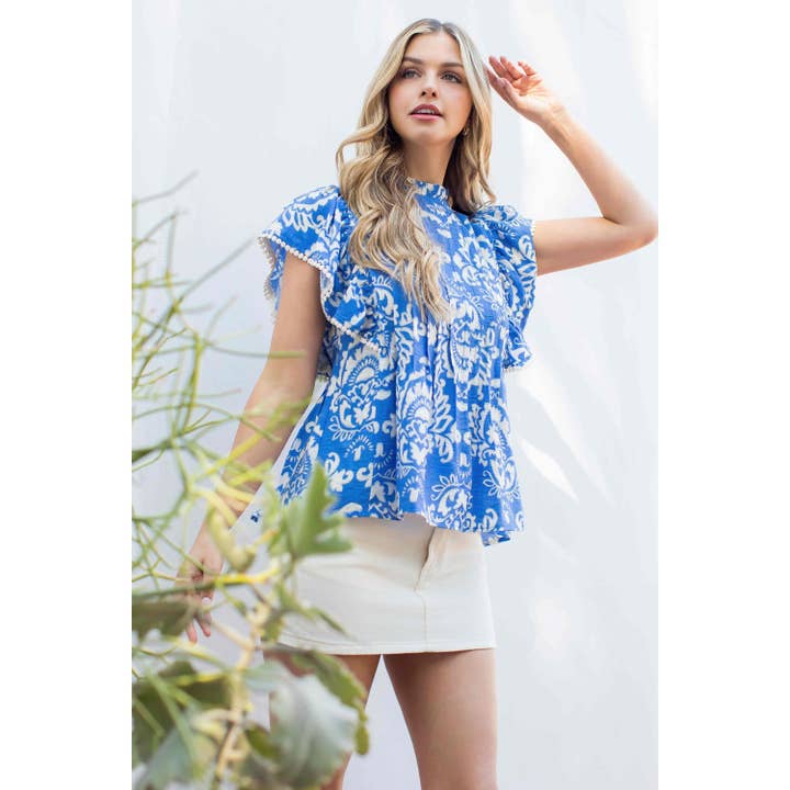 Haut imprimé à manches plissées et volants pour la vente par THML