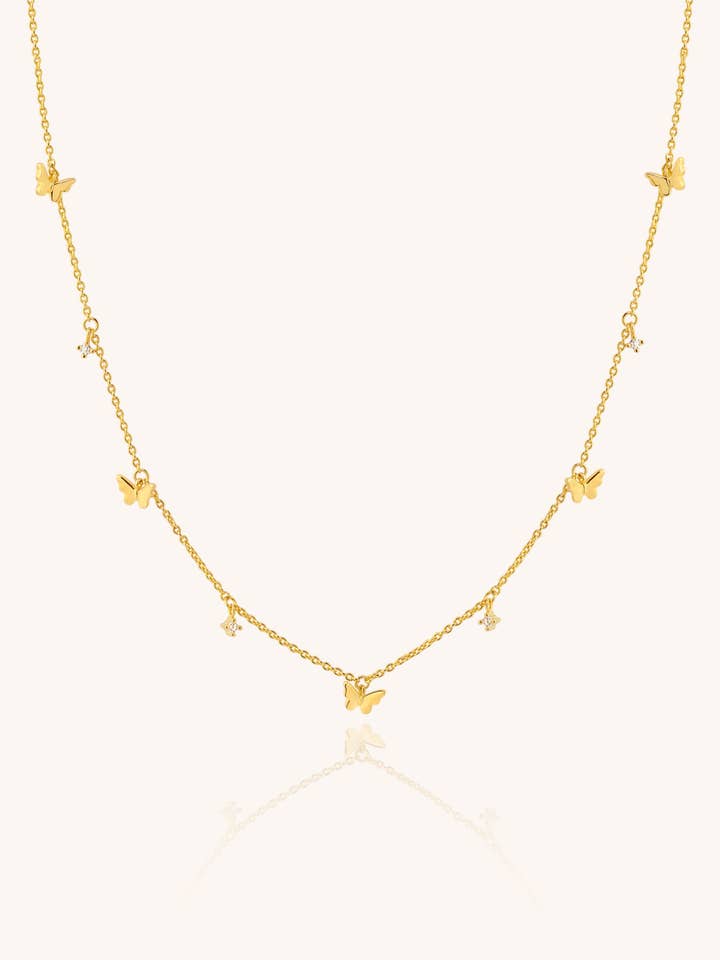 Collier doré FIVE BUTTERFLIES. pour la vente par Aran Jewels