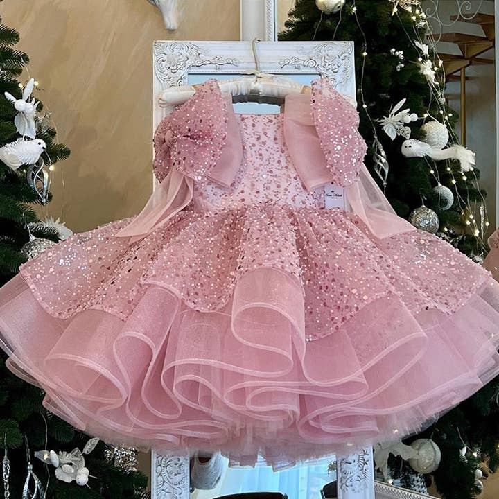 Abito rosa con paillettes a spalle scoperte e fiocco a trapezio per bambine per la vendita all'ingrosso da parte di shoplittleswan