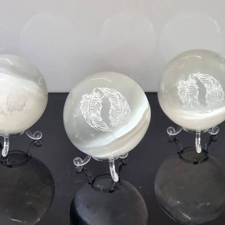 Selenite Crystal Sphere Etched Angel Feather for wholesale by Distinction Crystals