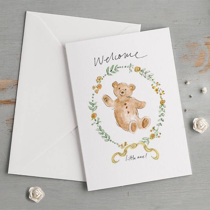 'Welcome Little One!' Teddy Bear & Floral Border New Baby Card for wholesale by Gabrielle Solly Illustration