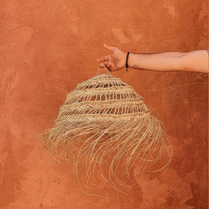 Moroccan ball shape suspension in fringed doum for wholesale by MARRAKECH METACRAFT LTD