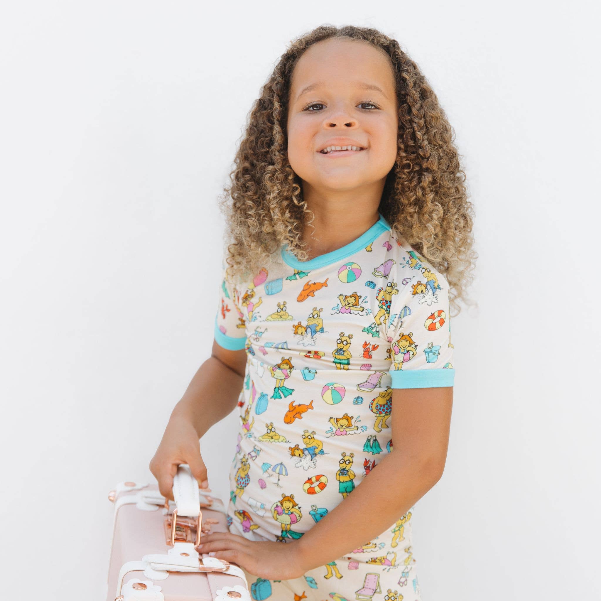 Cream Multi Arthur™ Family Vacation Bamboo Short Sleeve Kids Pajama Set for wholesale on Faire3