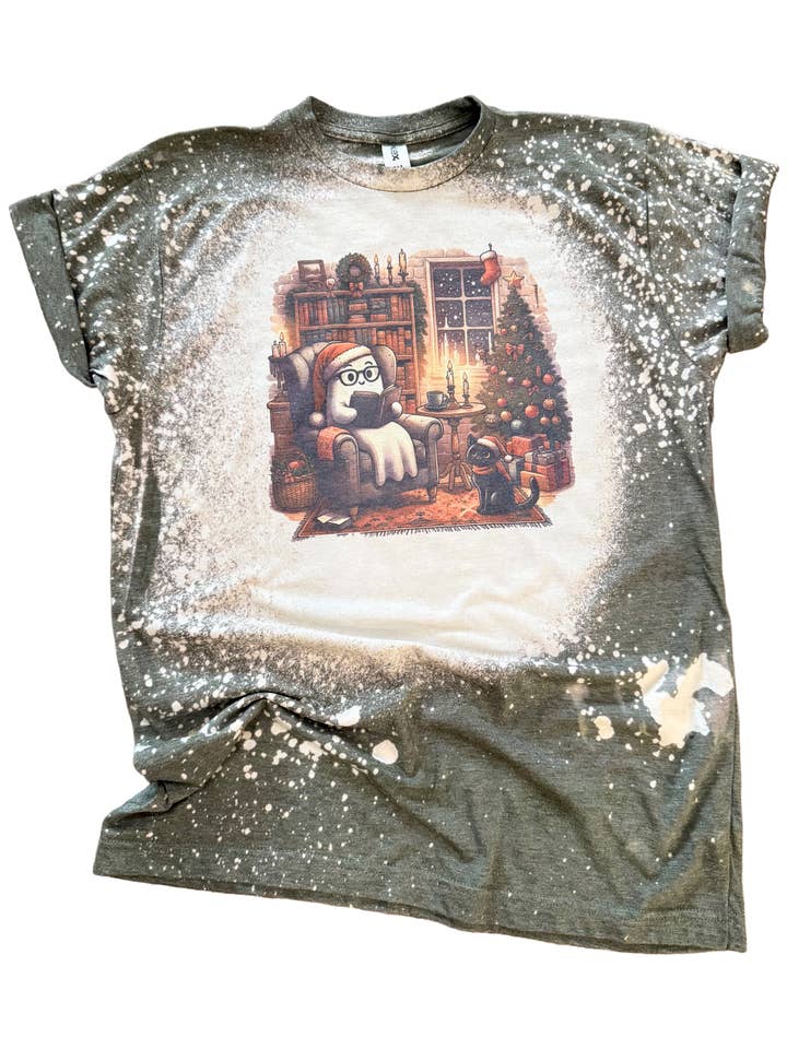 Cozy Christmas Ghost Reading Bleached Tee for wholesale by Pick Your Poison Tees LLC (Formerly Wandering Owl Designs)