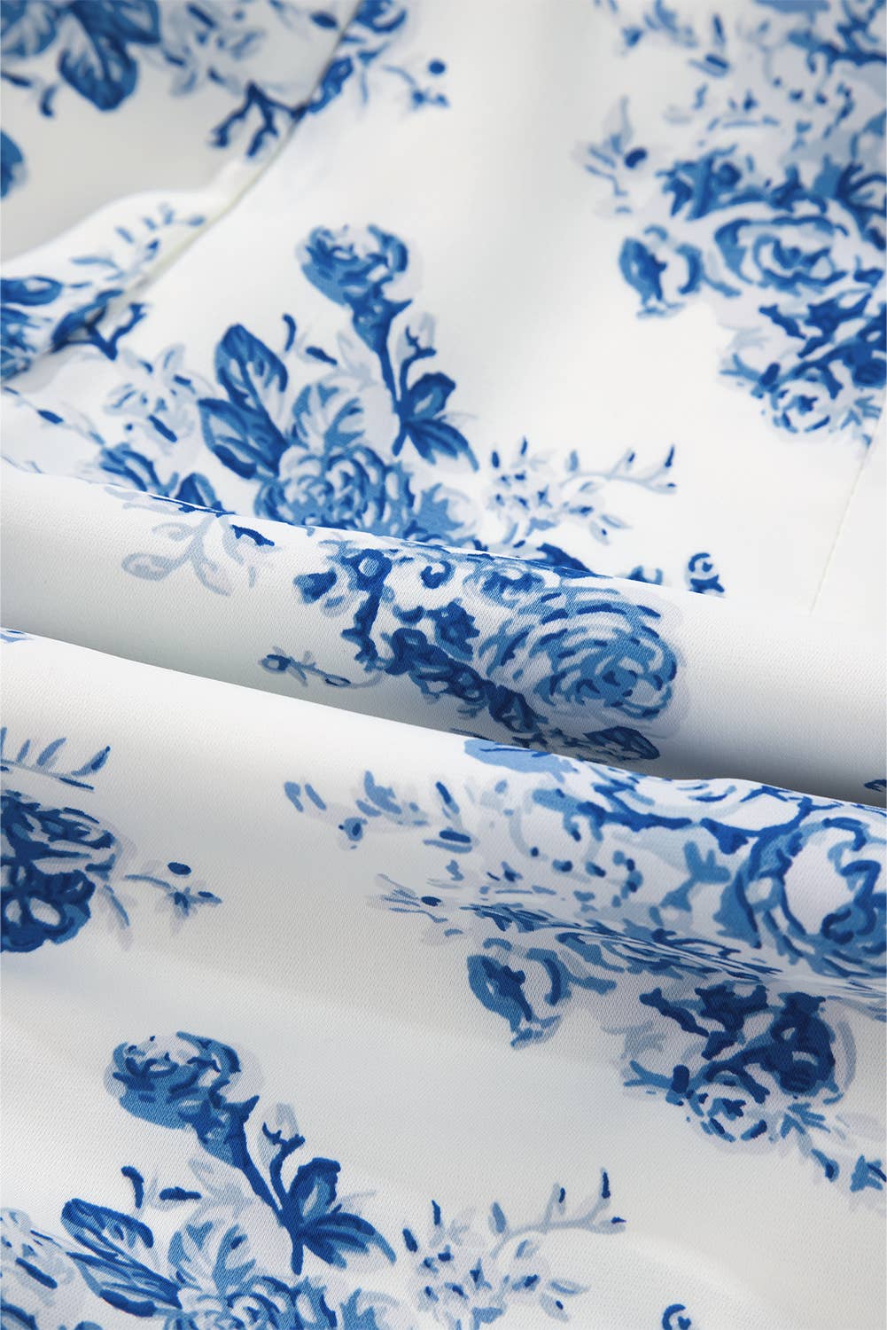 Blue Floral Print Strapless Zipped Back Knot Waist Ruffled Romper for wholesale on Faire13