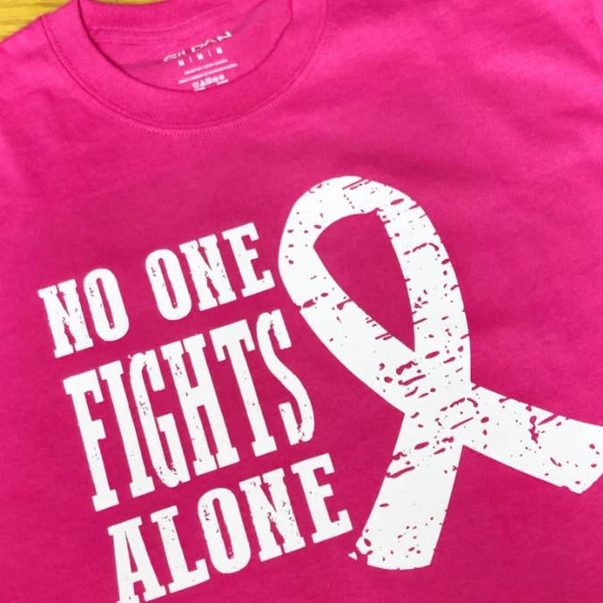 No One Fights Alone Cancer Graphic Tee or Sweatshirt for wholesale by Ashton Grove Ltd Co