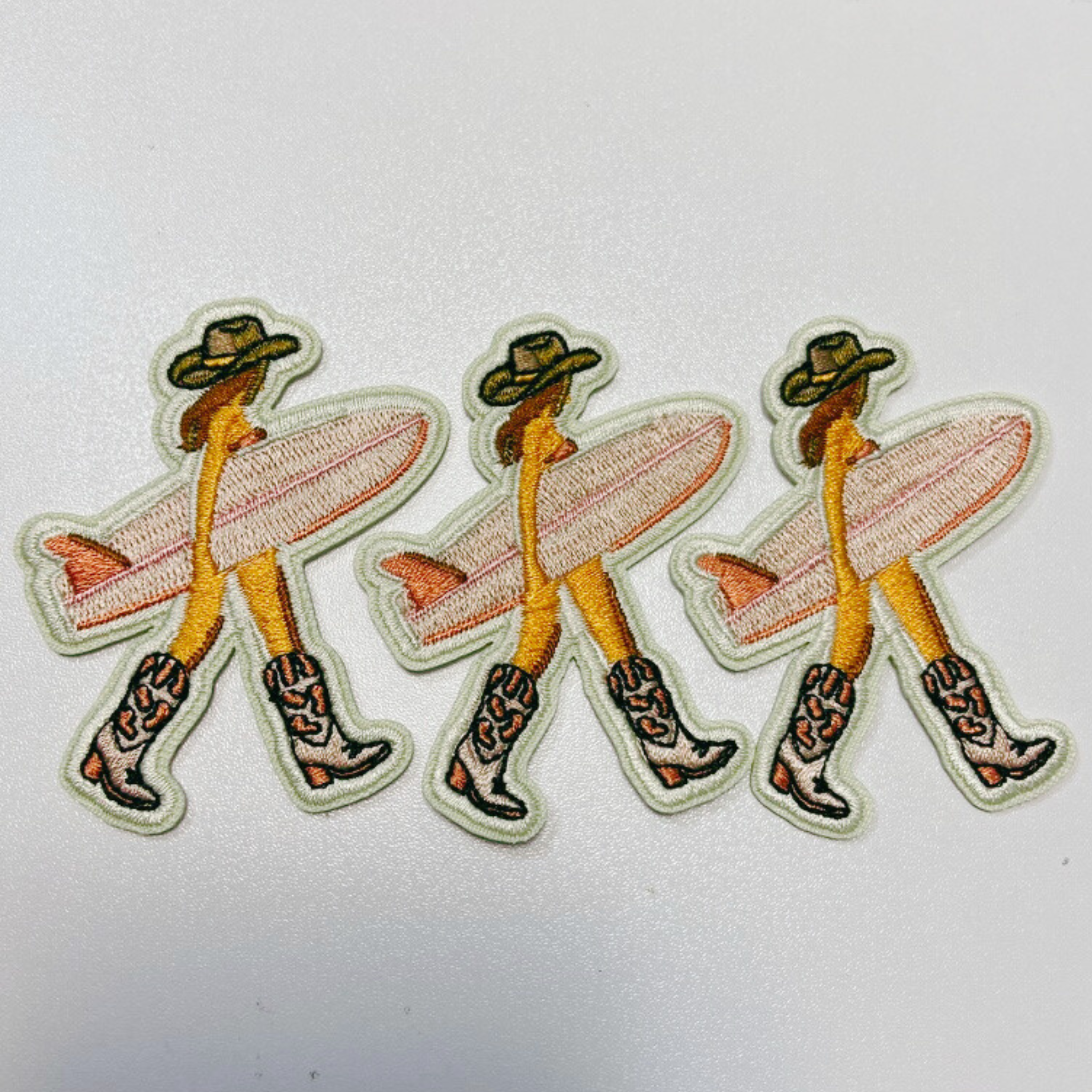 TEELUX - Wholesale Patch - 2.5" Cowgirl w Surfboard - Embroidered Hat Patch1
