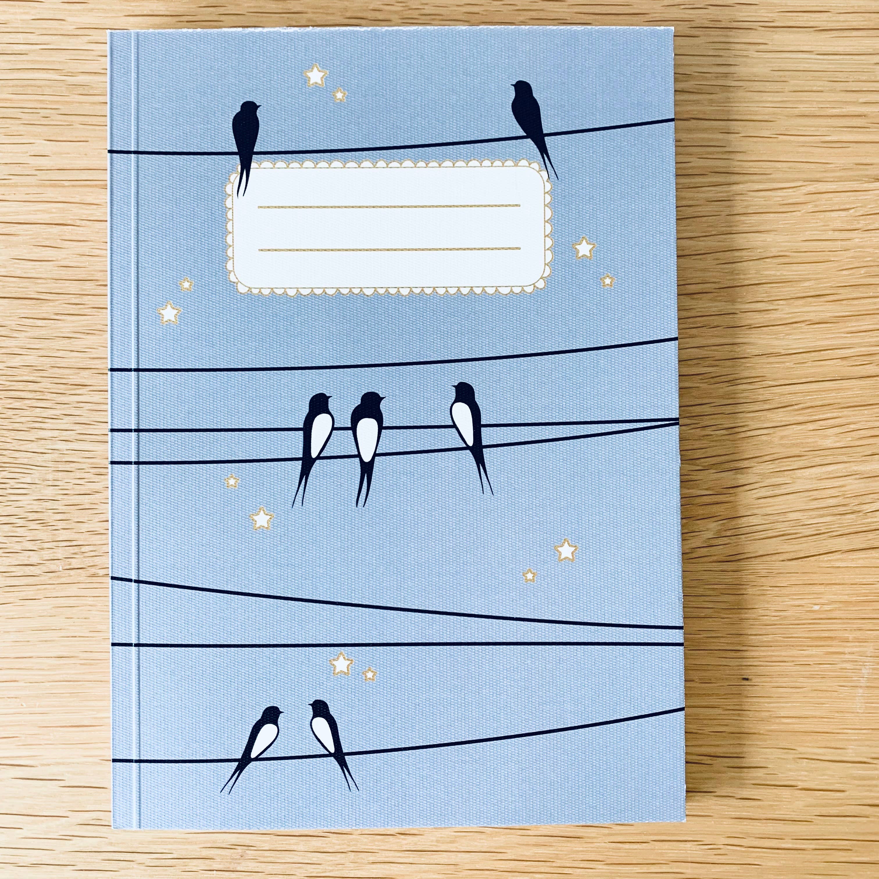 Les Petites Hirondelles - Wholesale Notebook - A5 notebook - Swallows on the wire - Blue sky1