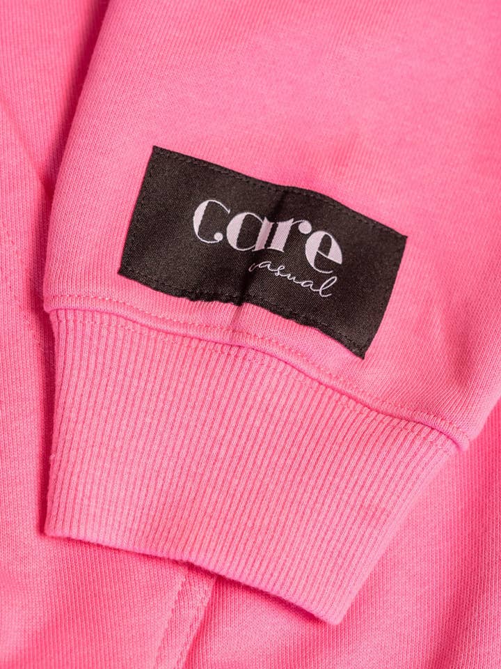 Rosa Hendrix Sudadera 100 Cosas Feliz Rosa de venta al por mayor en Faire2