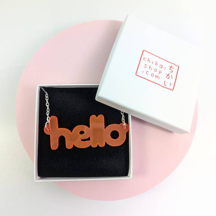 Hello necklace on neon pink translucent acrylic for wholesale by Chikai Shop