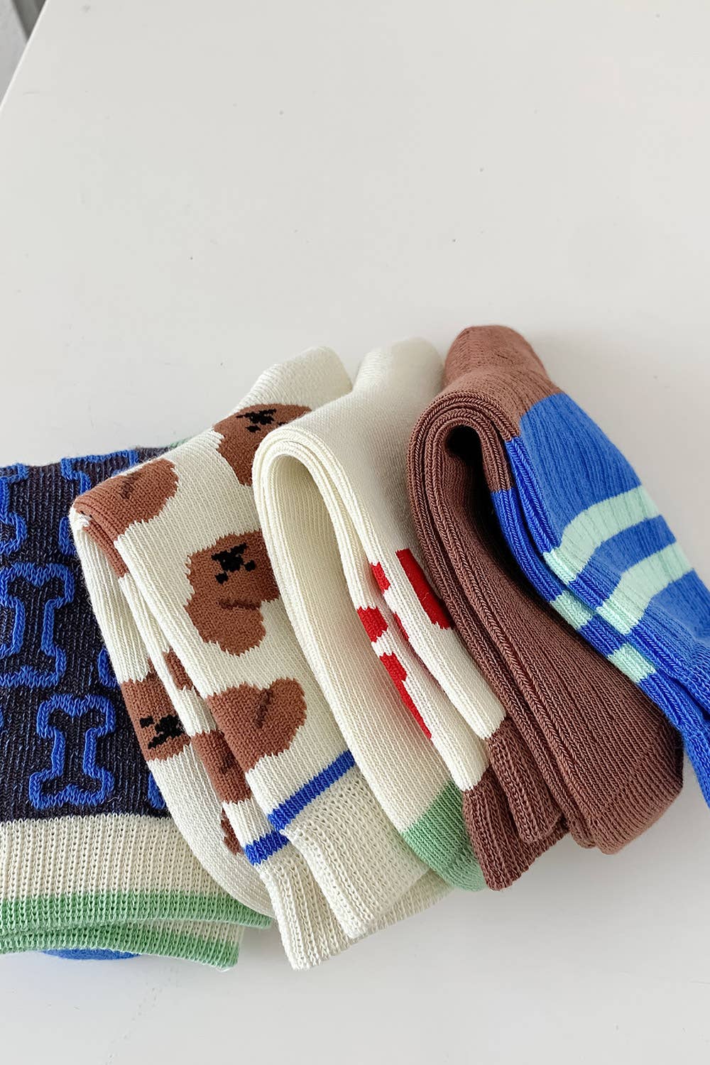 Multicolored 🧦✨ Pack of 4 Pairs of Fun Children's Socks 👶🎨 for wholesale on Faire2